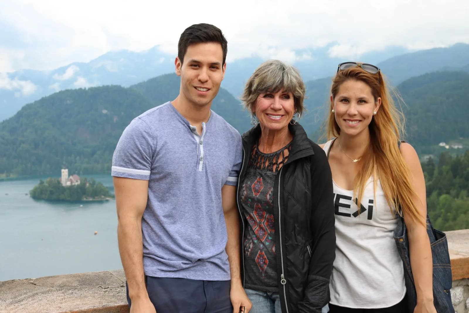 Adam and Amie Watanabe with their mother above Lake Bled